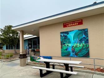Photo of exterior of Pacific Grove High School library with mural